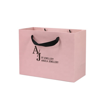 Лоснистое слоение обувает бумажные мешки одежды 250gam покрыло розовые сумки Kraft