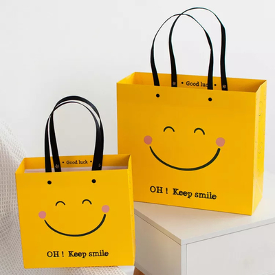 Квадрата бумажных мешков Kraft стороны улыбки удара ISO бумажный мешок устойчивого желтого нижний
