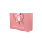 Лоснистое слоение обувает бумажные мешки одежды 250gam покрыло розовые сумки Kraft