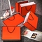 Хозяйственные сумки ботинок изготовленные на заказ бумажные бронзируя серебряные сумки цвета слоновой кости благосклонности 250gsm